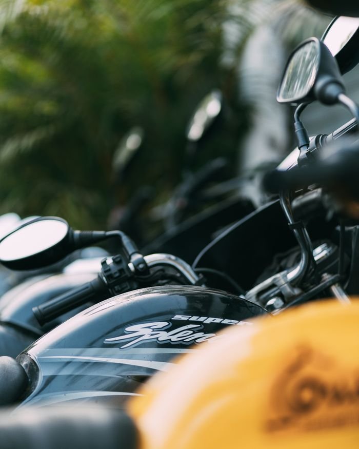 Home Close-up shot of a row of parked motorcycles with selective focus on shiny surfaces.