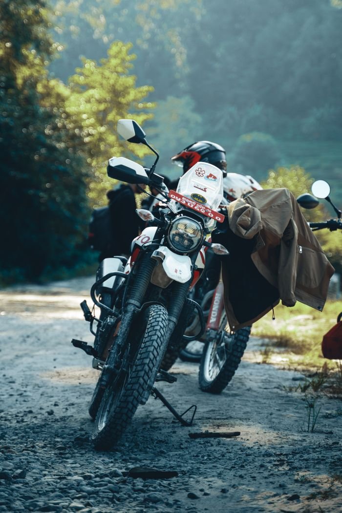 Home Motorcycles parked on a scenic trail in Nepal, perfect for adventure enthusiasts.
